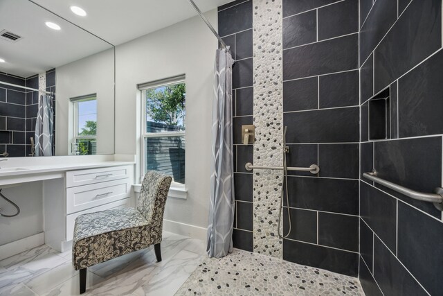 bathroom with a shower with shower curtain and vanity