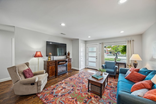 living room featuring dark hardwood / wood-style floors