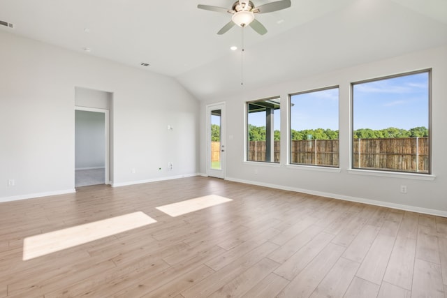 unfurnished room with ceiling fan, lofted ceiling, and light hardwood / wood-style flooring