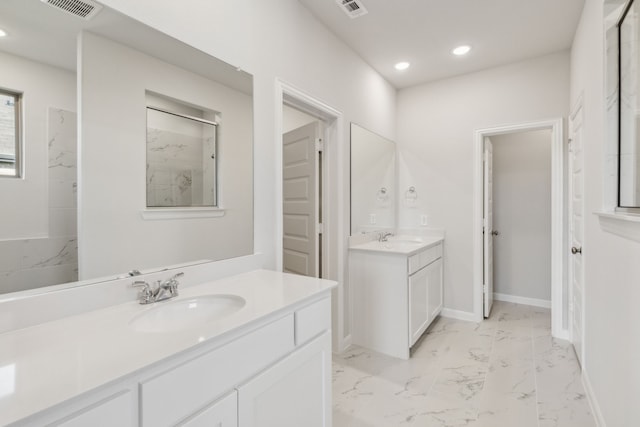 bathroom with walk in shower and vanity