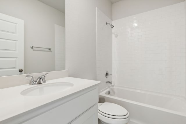 full bathroom with vanity, toilet, and tiled shower / bath combo