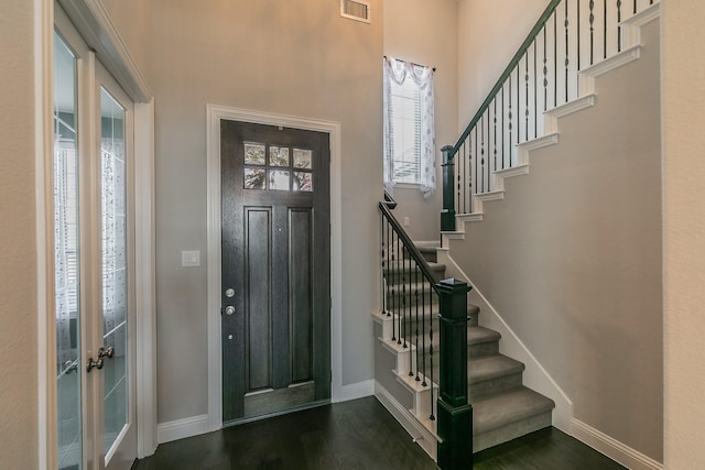 foyer with dark hardwood / wood-style flooring