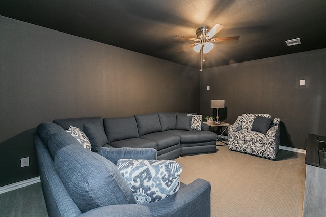 carpeted living room with ceiling fan