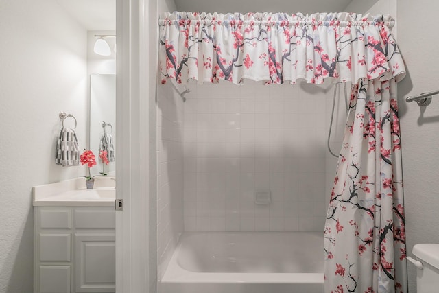 full bathroom with vanity, shower / bathtub combination with curtain, and toilet