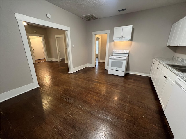 kitchen with white cabinetry, white appliances, dark wood-type flooring, and a textured ceiling