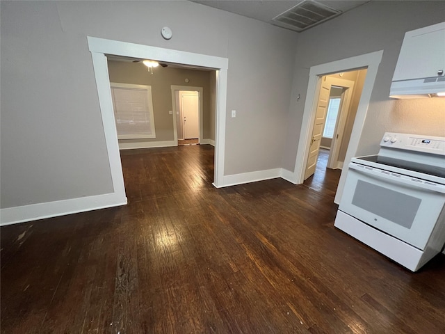 kitchen featuring white cabinetry, exhaust hood, white electric stove, and dark hardwood / wood-style floors