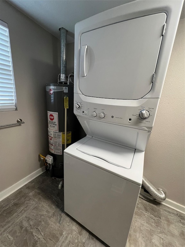 laundry room with stacked washer and dryer and gas water heater