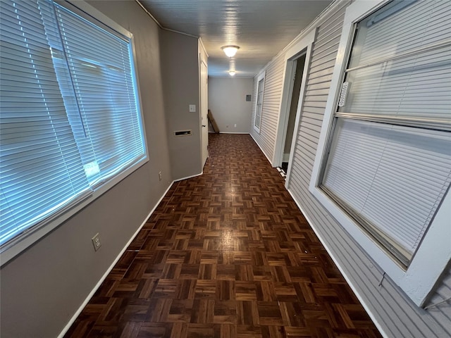 corridor with dark parquet flooring