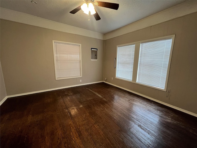 unfurnished room with ceiling fan, a textured ceiling, and dark hardwood / wood-style flooring