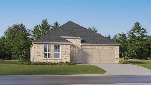 view of front of home with a front yard and a garage