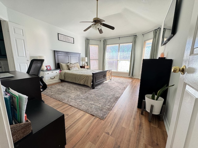 bedroom featuring hardwood / wood-style flooring and ceiling fan