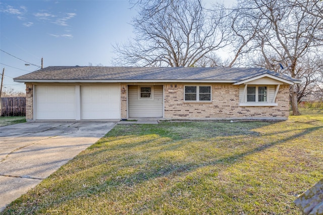 ranch-style house featuring a front yard and a garage