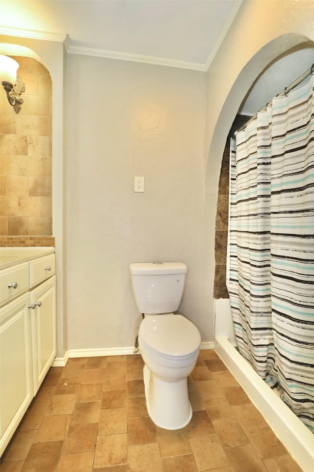 bathroom with a shower with shower curtain, vanity, toilet, and ornamental molding