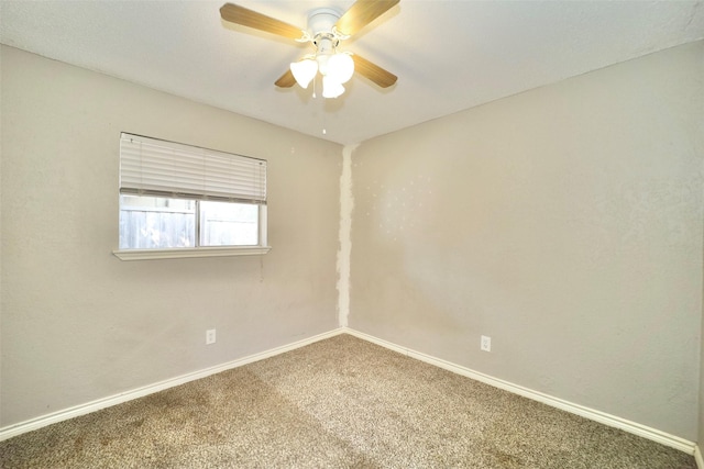 unfurnished room with ceiling fan and carpet floors