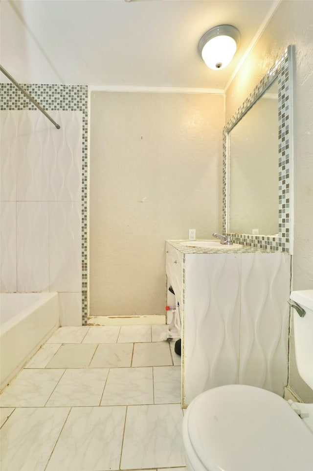 full bathroom with toilet, tiled shower / bath, and sink