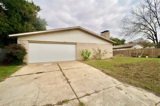 view of home's exterior with a yard and a garage