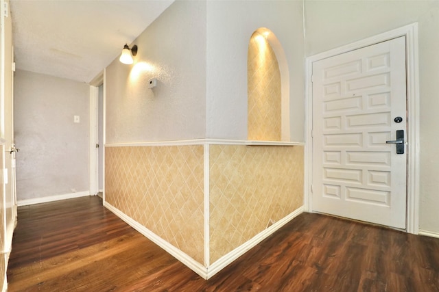 corridor featuring dark hardwood / wood-style floors