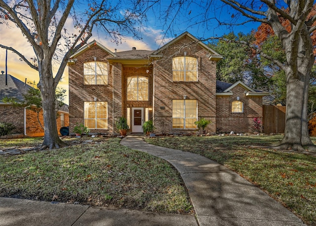 view of front property with a yard