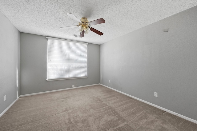 carpeted empty room featuring a textured ceiling and ceiling fan