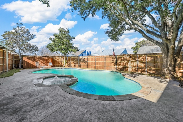 view of swimming pool with an in ground hot tub and a patio