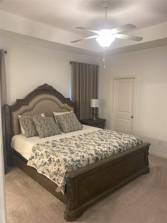 bedroom with ceiling fan and carpet floors