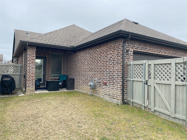 view of home's exterior with a yard