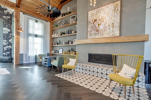 sitting room with lofted ceiling, a large fireplace, and wooden ceiling