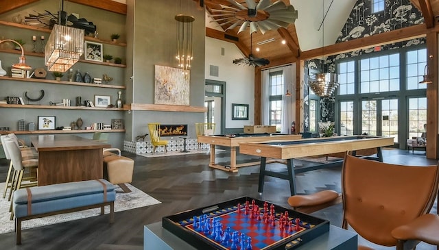 recreation room with high vaulted ceiling and pool table