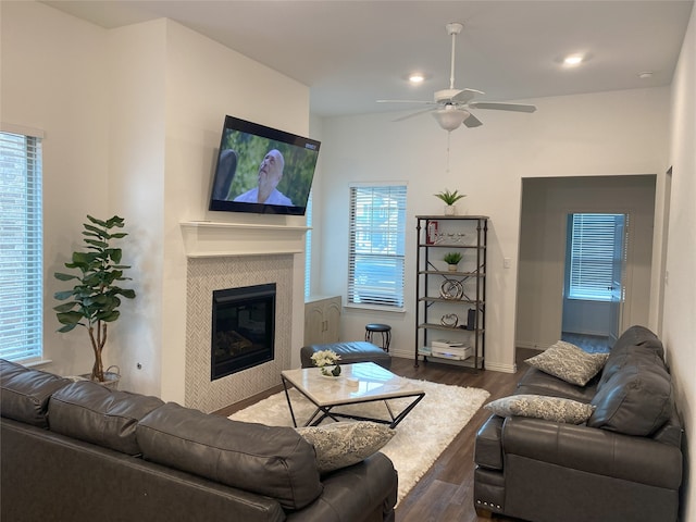 living room with dark hardwood / wood-style floors and ceiling fan