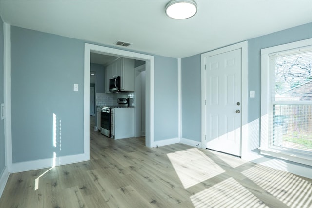 entrance foyer with light hardwood / wood-style flooring