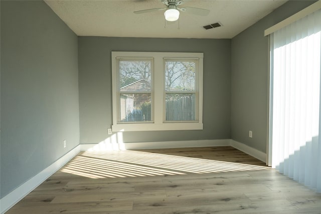 spare room with ceiling fan and light hardwood / wood-style flooring