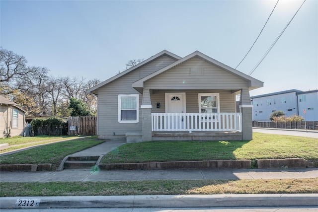 ranch-style home with covered porch