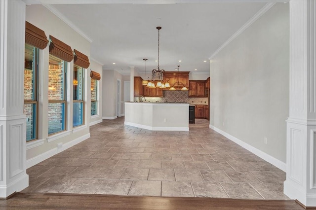 kitchen with backsplash, pendant lighting, crown molding, and a kitchen island