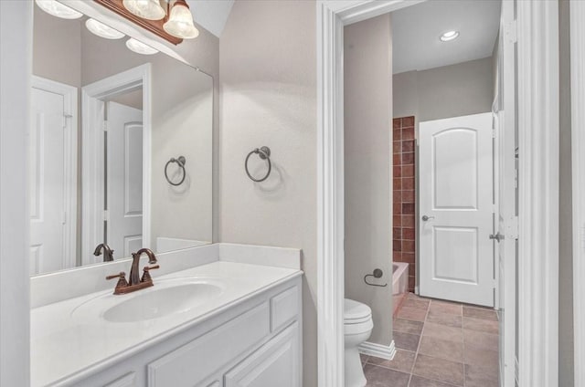 full bathroom with toilet, tile patterned flooring,  shower combination, and vanity