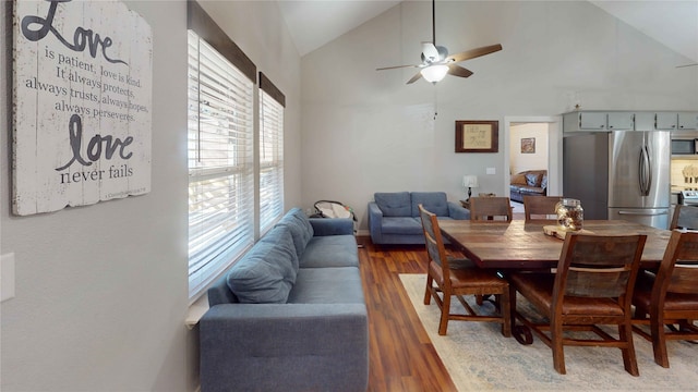 dining area featuring hardwood / wood-style flooring, plenty of natural light, lofted ceiling, and ceiling fan