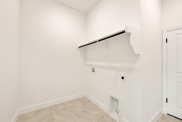 laundry area featuring baseboards, washer hookup, laundry area, hookup for a gas dryer, and hookup for an electric dryer