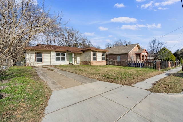 ranch-style home with cooling unit and a front lawn