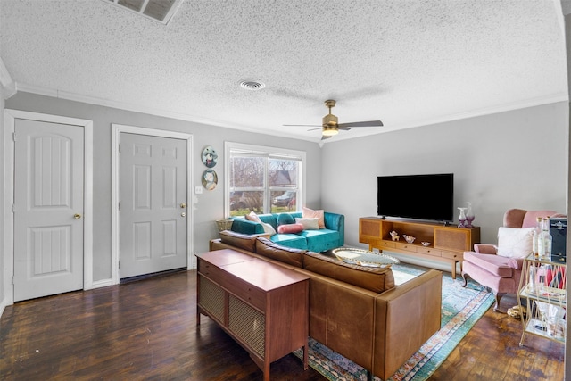 living room with ornamental molding, dark hardwood / wood-style floors, a textured ceiling, and ceiling fan