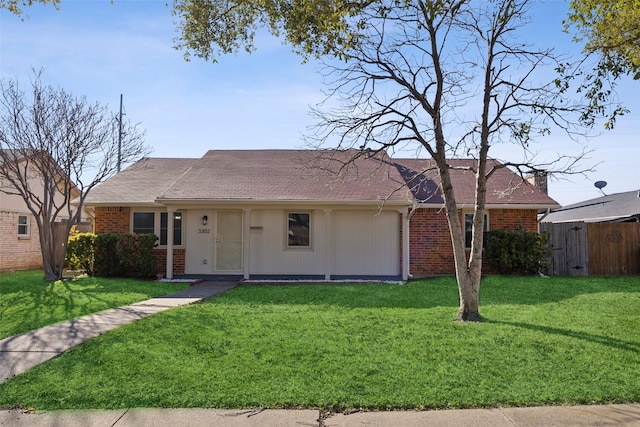 ranch-style home with a front lawn