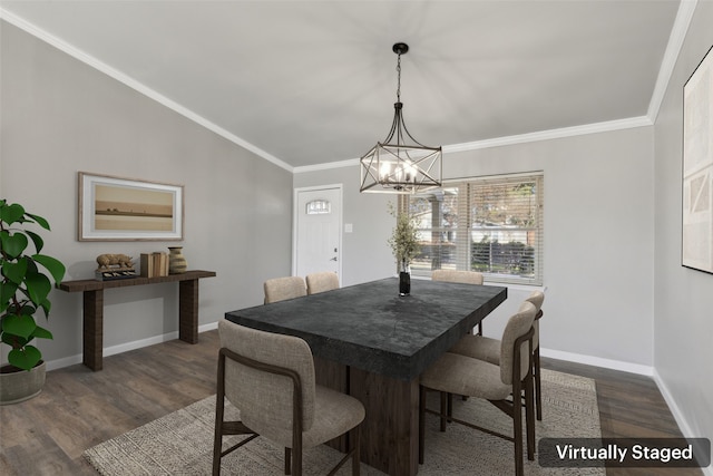 dining space with dark wood-type flooring, lofted ceiling, crown molding, and an inviting chandelier