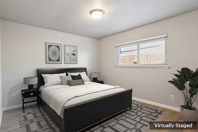 bedroom with dark hardwood / wood-style floors