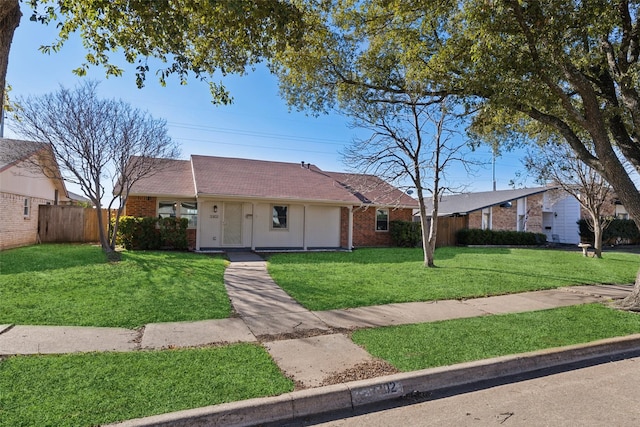 ranch-style house featuring a front lawn