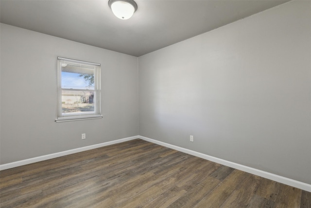 unfurnished room featuring dark hardwood / wood-style floors