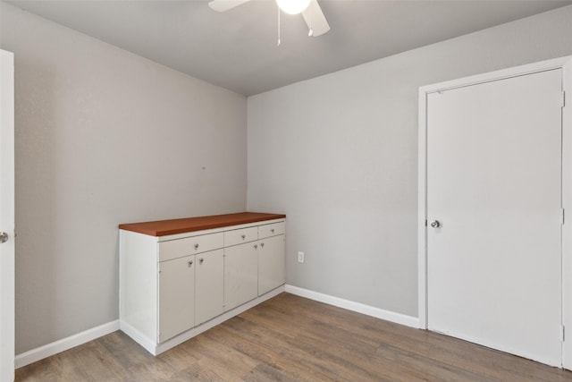 unfurnished bedroom featuring ceiling fan and light wood-type flooring