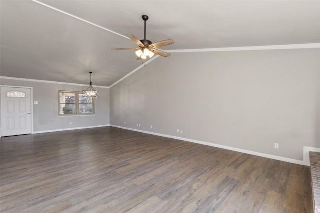 interior space featuring ceiling fan with notable chandelier, dark wood-type flooring, vaulted ceiling, and ornamental molding