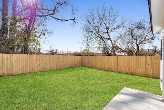 view of yard with a fenced backyard