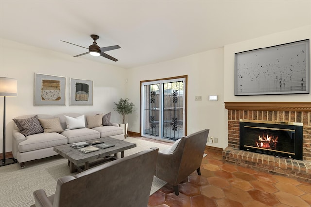 living room featuring ceiling fan and a fireplace