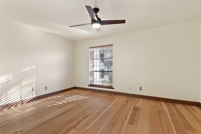 empty room with ceiling fan and wood-type flooring