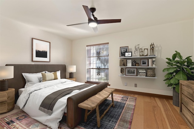 bedroom featuring light wood-type flooring and ceiling fan