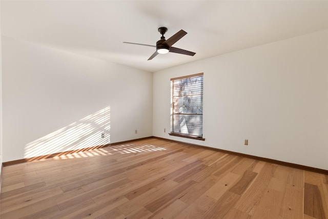 spare room with ceiling fan and light wood-type flooring